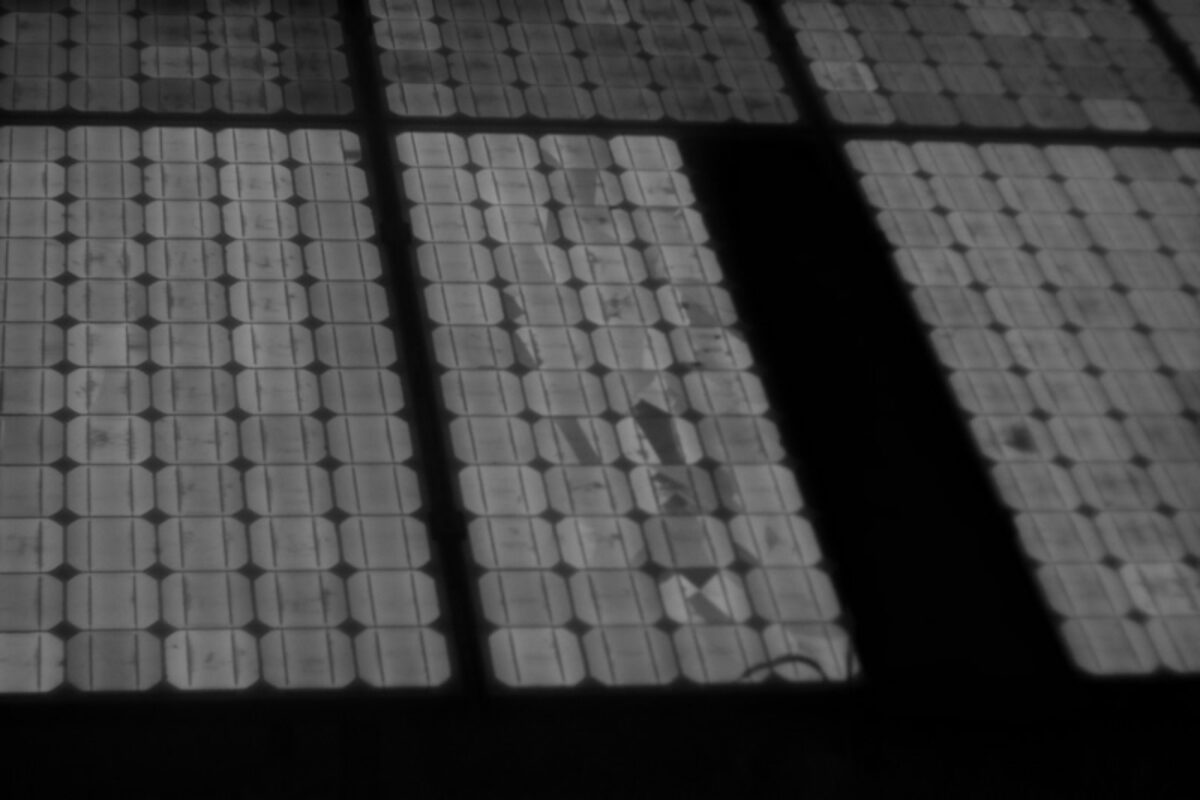 Electroluminescence image revealing cracked and inactive solar cells within modules