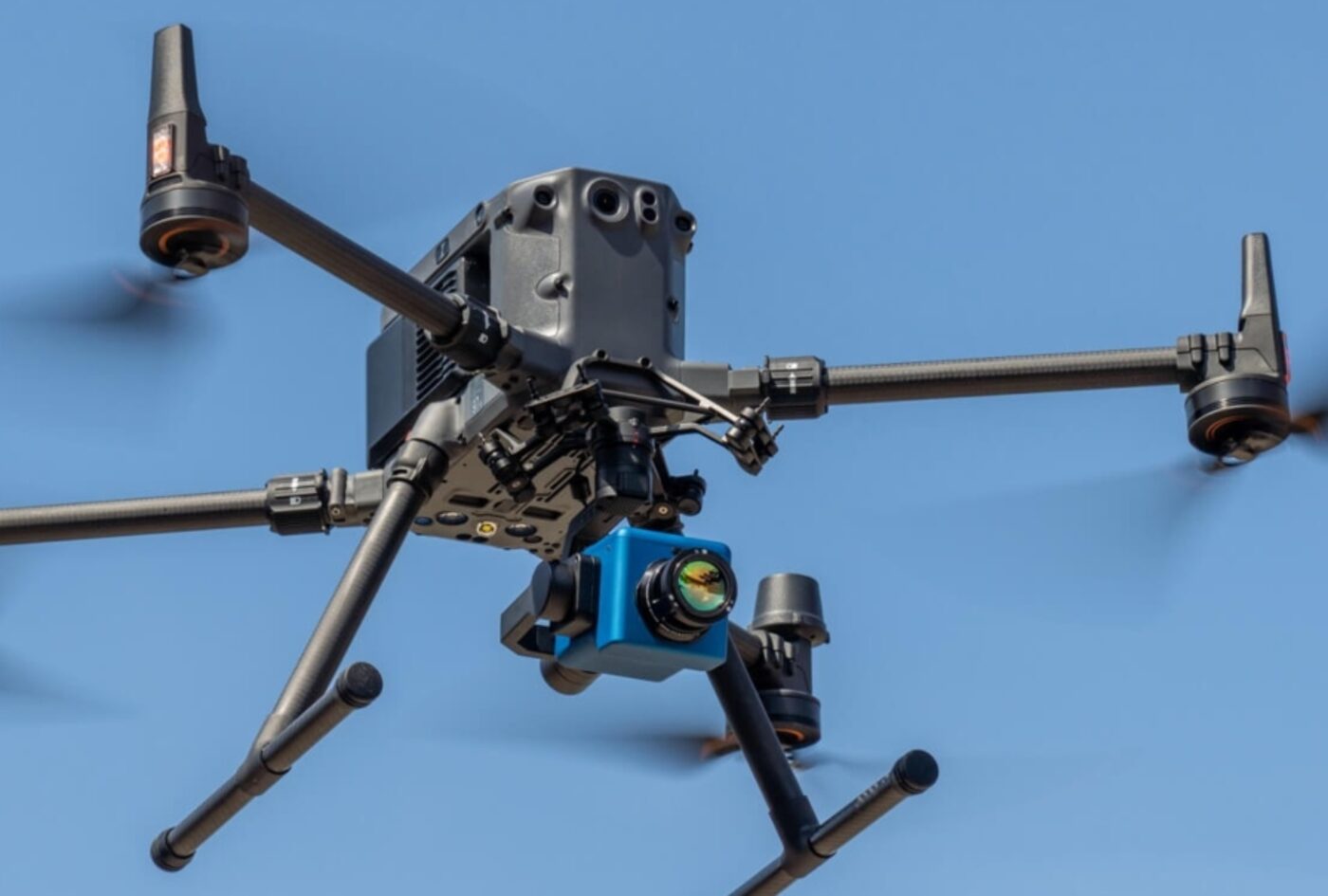 Survey drone fitted with a methane sensing payload in flight